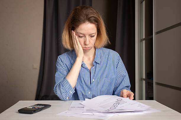 istock Stressed woman with debt utility bill, overdue notice and financial problem, high electricity price 2202649952