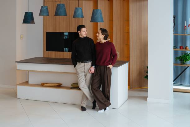 istock Couple enjoying a casual moment in a modern kitchen setting 2202654897