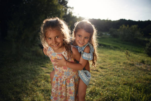 istock Beautiful children enjoying outdoors 2202655986