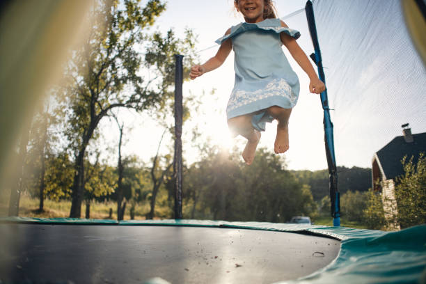 istock Beautiful girl enjoying summer on trampoline 2202656134