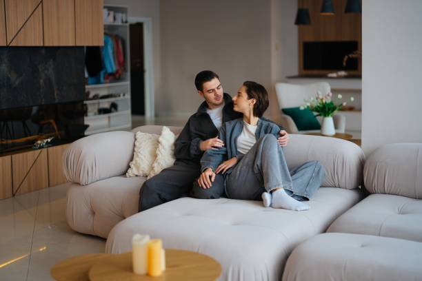 istock Cozy moments shared between couple in modern living room setting 2202662608