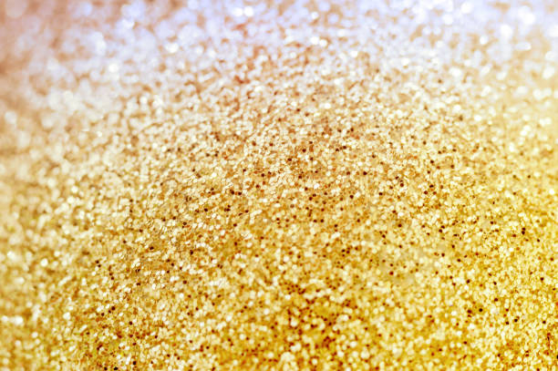 istock Gold Background. The background is orange. Yellow glittery background. 2202662799