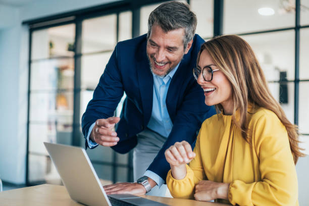 istock Two business coworkers talking 2202663801