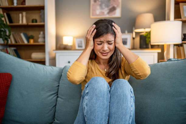 istock Upset woman at home 2202663818