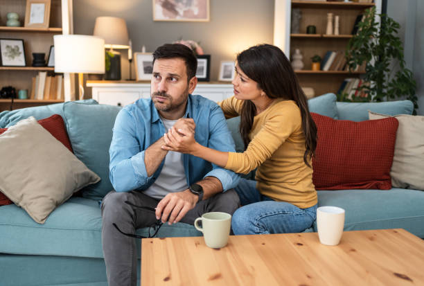istock Woman comforting her husband 2202663867