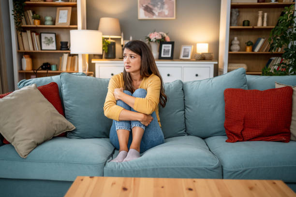 istock Worried woman at home 2202663927