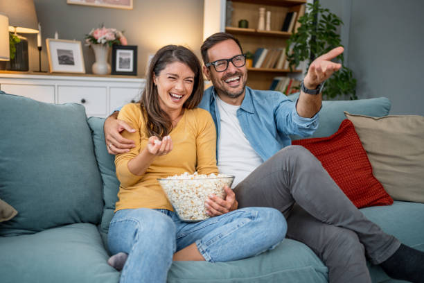istock Young couple watching comedy movie 2202664927