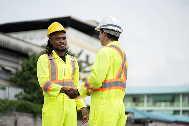 istock African American engineer hand shake with Caucasian engineer at container site 2202665049