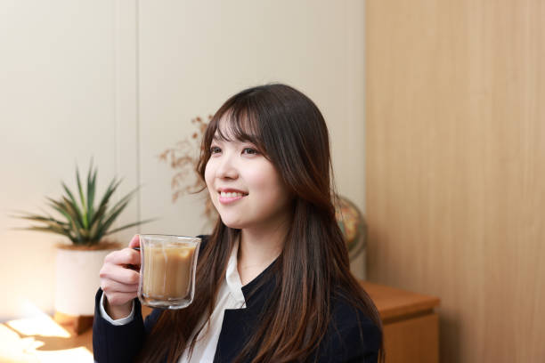Young adults enjoying a cup of coffee made with Iced Espresso Latte coffee sachet.