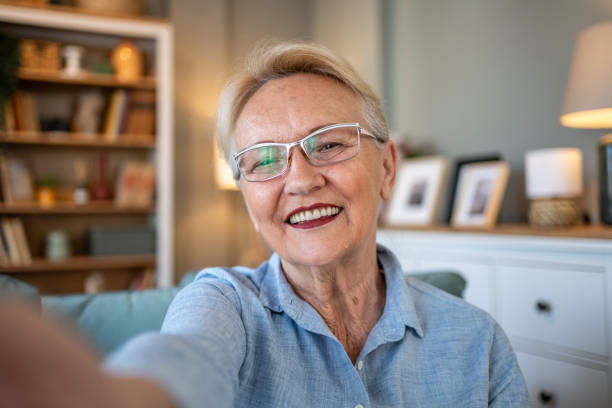 istock Senior woman smiling for a selfie 2202667857