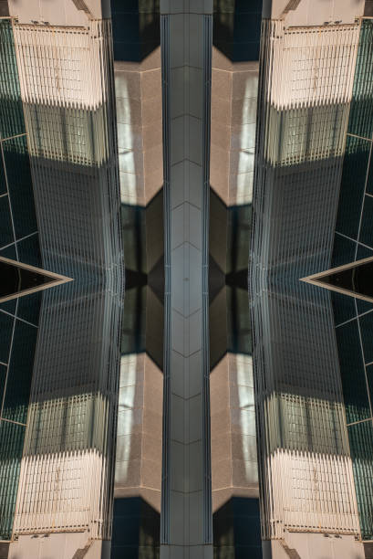 istock Geometric patterns created by reflections on modern glass buildings in an urban setting during the early afternoon 2202668355