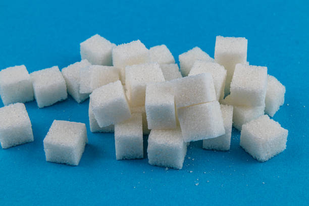 Sugar Cubes Stacked Against White Background