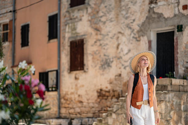 istock Young woman in an old town 2202670425