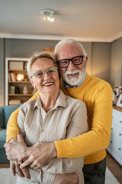istock Senior couple enjoying a loving hug 2202670432
