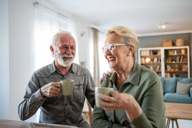 istock Older couple spending time together with coffee and tablet 2202671874