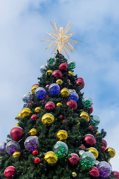 istock Beautifully decorated Christmas tree with colorful ornaments shining bright 2202672548