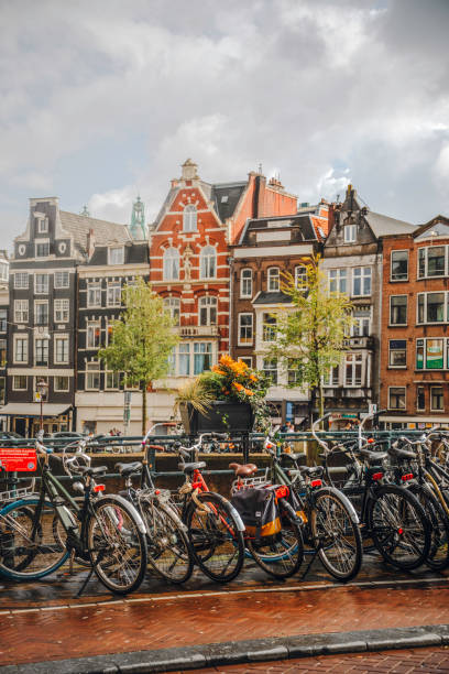 istock Bicycles Parked Along a Canal in Amsterdam, Netherlands 2202677850