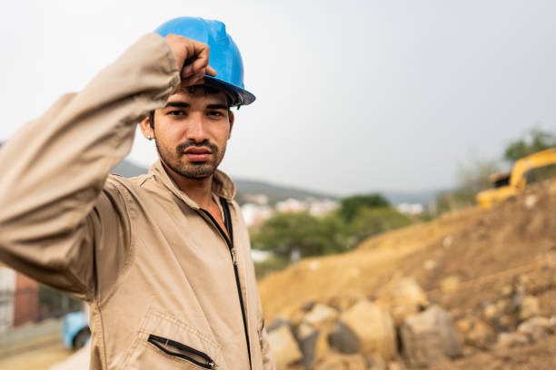Portrait of a young male engineer at a construction site