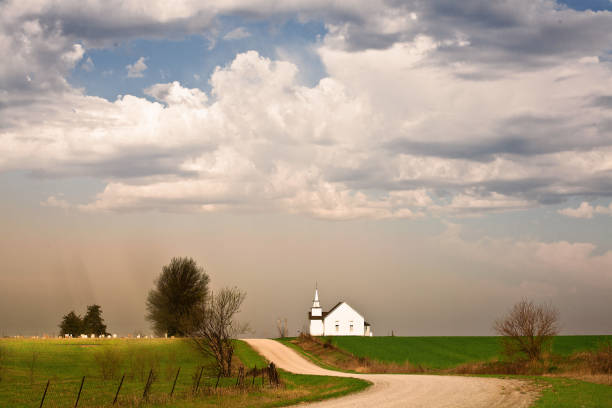 a white country church with blue sky background