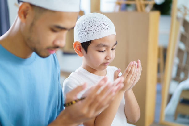 istock Asian muslim man and son are praying for Allah. 2202685240