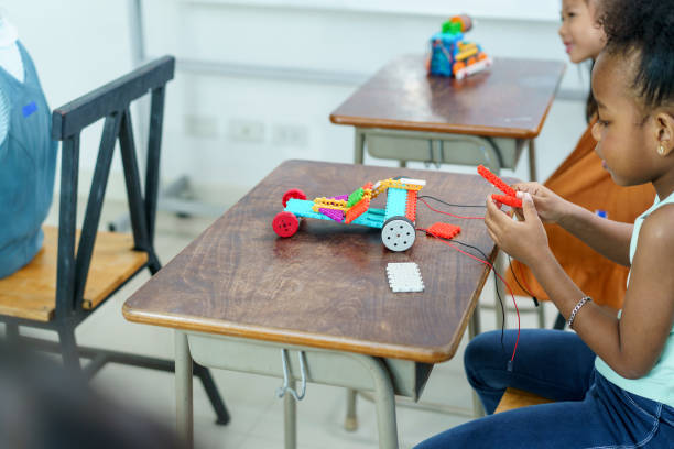 istock Group of diverse children enjoy learning about the STEM. 2202685398