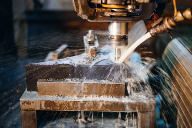 istock Metalworking machine cutting with cooling liquid showcasing precision manufacturing and industrial process 2202687669