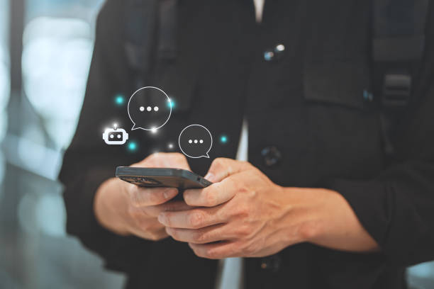 istock Digital AI chatbot, Happy young tourist man using mobile smartphone with AI chatbot for online information in city town, conversation assistant, technology 2202690941