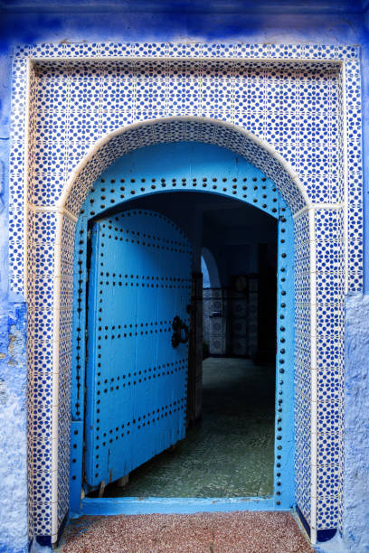 istock Traditional Blue Tunisian Door Framed by Ceramic Tile Patterns 2202691765