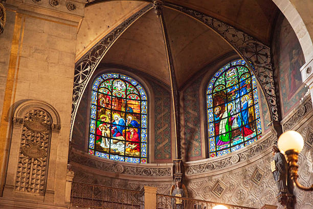 Coloured stained glass window in old church isolated on square white background with copy space and clipping path, full frame square composition