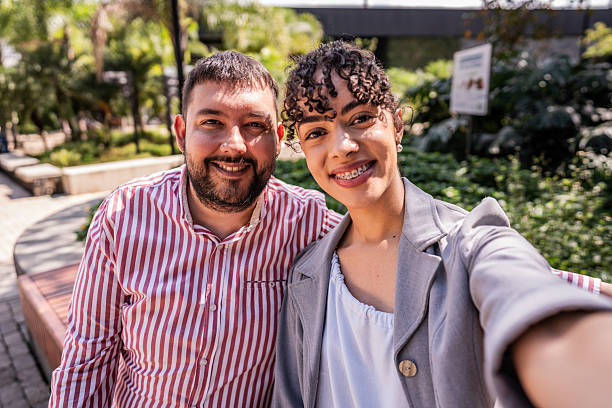 istock Coworkers taking selfie in a square 2202694022