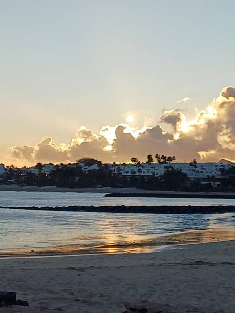 istock Costa Teguise Beach at sunset 2202696949