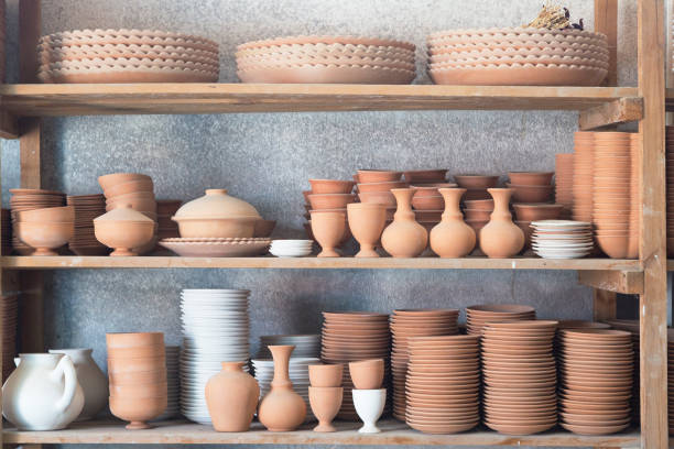 istock Pottery on shelves in a pottery workshop 2202696954