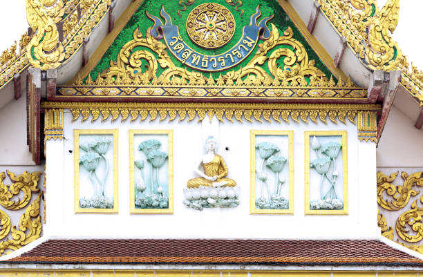 Traditional Buddhist temple Wat Choeng Thale in Phuket surrounded by lush greenery.