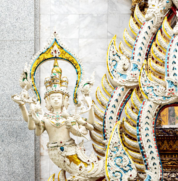 istock protective figure with several faces and arms decorated with colorful crystals 2202697373