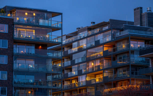 glass-fronted apartments with warm lights.
