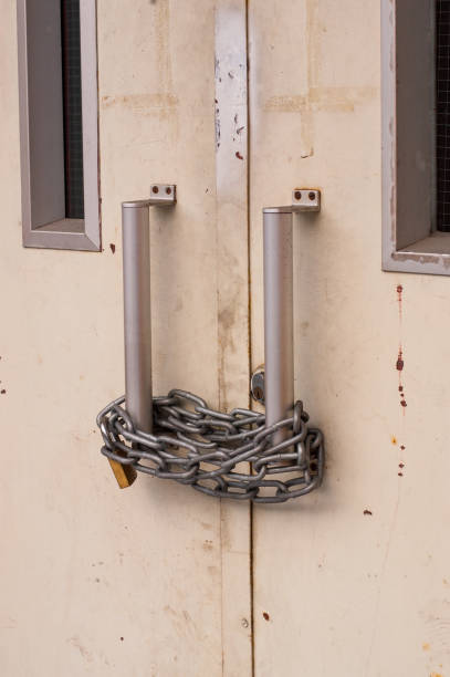 heavy chain with padlock securing metal doors