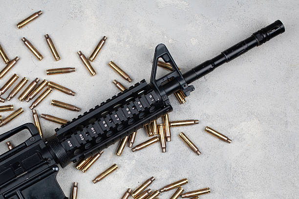 istock M4 carbine and 5.56mm shells and magazine with bullets 2202702187