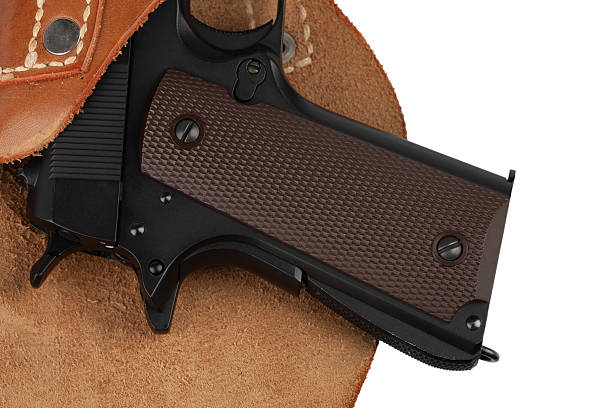 istock M1911 Automatic Pistol, Caliber .45 in holster 2202702639