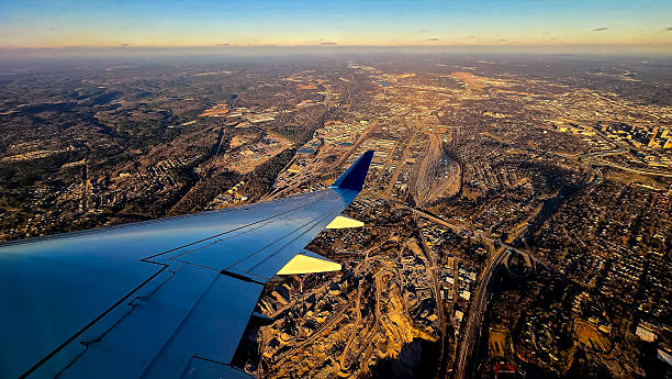 istock Looking out of an Airplane Window at Sunset while in Flight, Taking Off from Birmingham, Alabama 2202703321