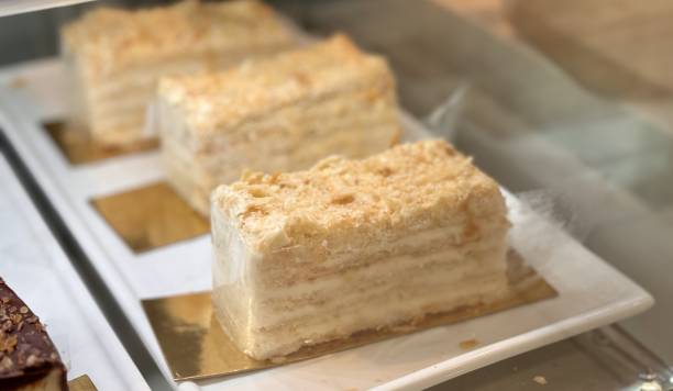 istock A visually stunning display of elegantly layered cakes, showcasing their smooth texture and inviting indulgence 2202709983