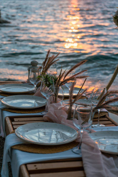 istock A beautiful sunset dinner setup on the beach, just a few steps from the sea. 2202712002
