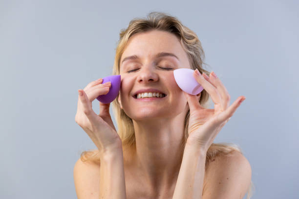 istock A Woman Enjoying Her Skincare Routine While Using Beauty Sponges for a Flawless Makeup Application and Healthy Skin in a Calm, Soft Atmosphere with Natural Lighting 2202716518