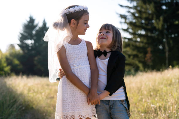 istock Two smiling friends playfully posing in a picturesque setting 2202718537