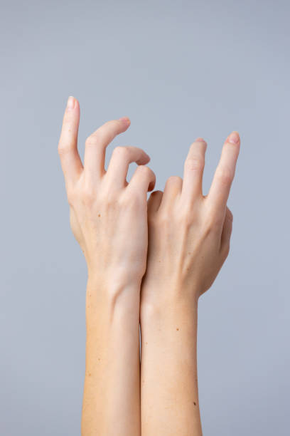 istock Intricate Hand Gestures Showcasing Elegance and Expression in a Minimalistic Setting with Soft Gray Background 2202718877