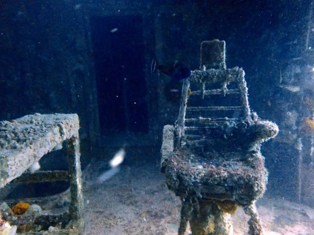 istock Empty captain’s chair on bridge of sunken ship 2202721405
