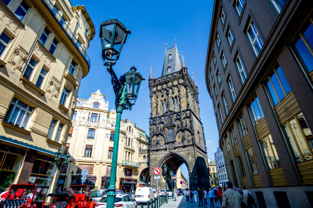 Prague, Bohemia - CZ - June 2, 2023 The Powder Tower in Prague, Czech Republic, a Gothic-style gateway to the Old Town. The historic landmark is surrounded by elegant buildings and lively streets.