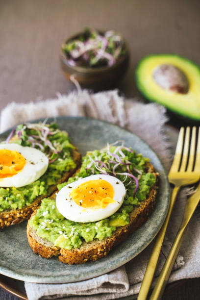 istock Elegantly Styled Avocado Toast with Eggs 2202730617