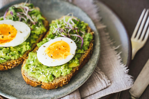 istock Delicious Double Toast with Eggs and Sprouts 2202730627