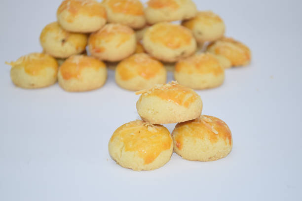 The image shows a collection of pineapple cookies, a delightful dessert displayed on a white surface.