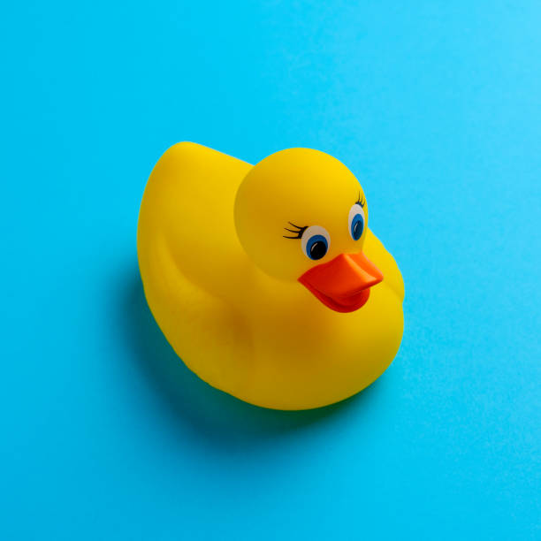 istock Rubber Yellow Ducky on a Blue Background 2202748915